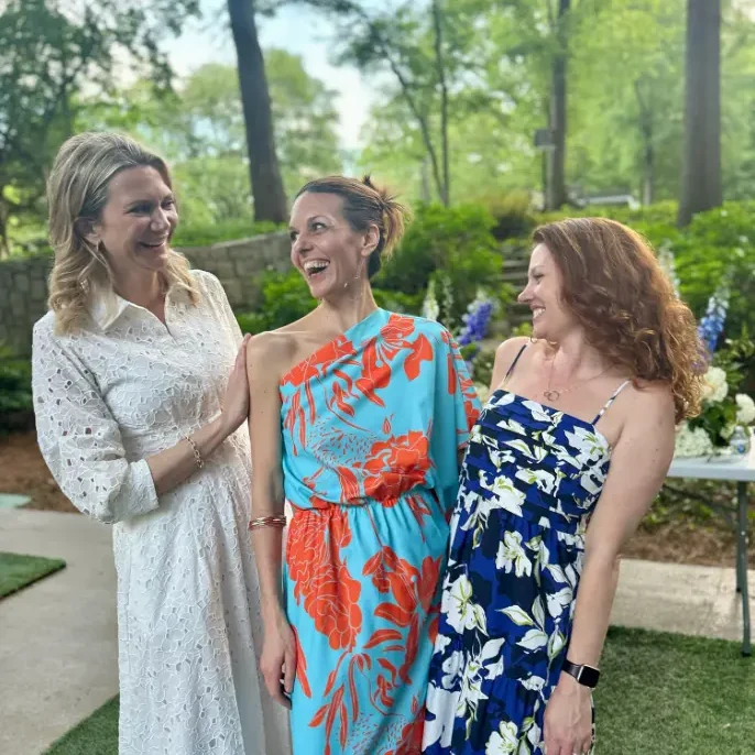 three wome smiling