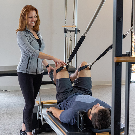 Physical Therapy on legs with trainer