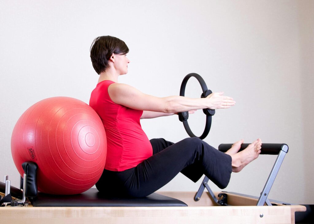 Woman using Pilates machine